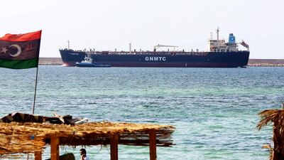 Above, the Libyan oil tanker Anwar Libya arrives at the port of Tripoli. The IEA has warned that the risks of forecasting ahead were currently “particularly high” because of geopolitical uncertainty. Mahmud Turkia / AFP