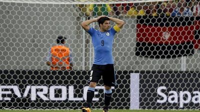 Luis Suarez of Uruguay reacts. REUTERS/Paulo Whitaker