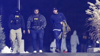 US federal law enforcement agents, including the FBI, leave a storage facility in New Hampshire where Claudio Neves Valente was found dead. Reuters