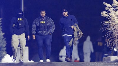 US federal law enforcement agents, including the FBI, leave a storage facility in New Hampshire where Claudio Neves Valente was found dead. Reuters