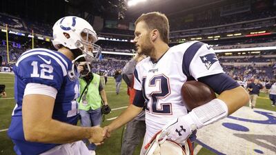 New England Patriots quarterback Tom Brady, right, greets Indianapolis Colts quarterback Andrew Luck Michael Conroy / AP Photo