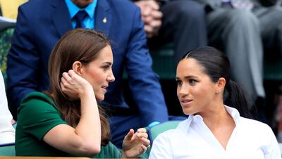The Duchess of Cambridge and The Duchess of Sussex on day twelve of the Wimbledon Championships at the All England Lawn Tennis and Croquet Club, Wimbledon. Photo: PA