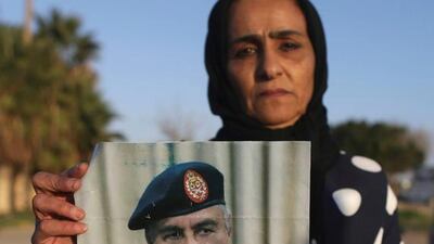 A demonstrator holds a picture of Eastern Libyan military commander Khalifa Haftar during a protest in Benghazi, Libya, February 12, 2017. Esam Omran Al Fetori / Reuters