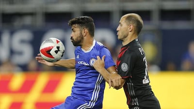 Chelsea striker Diego Costa in action with AC Milan’s Gabriel Paletta. Eric Miller / Reuters