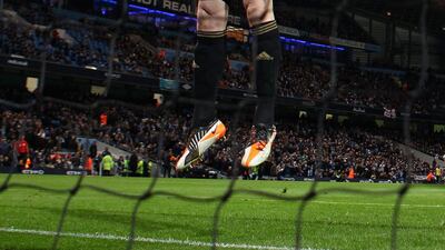 Swansea City substitute goalkeeper Gerhard Tremmel warms up after coming on against Manchester City. Clive Brunskill/Getty Images