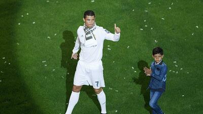 Cristiano Ronaldo, left, of Real Madrid acknowledges the audience with his son Cristiano Ronaldo Jr. during the celebration with their fans at Santiago Bernabeu Stadium the day after winning the Uefa Champions League Final. Gonzalo Arroyo Moreno/Getty Images