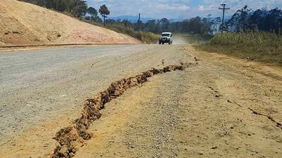 A large crack is seen in a highway near the town of Kainantu, following the powerful quake.