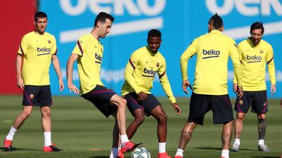Sergio Busquets and Ansu Fati compete for the ball during a training session at Ciutat Esportiva Joan Gamper. Getty Images