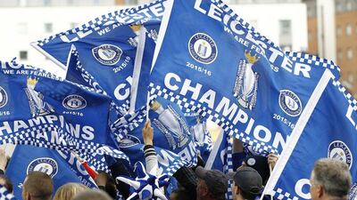 Fans wave champions falgs after Leicester City clinched the Premier League title. Craig Brough / Reuters