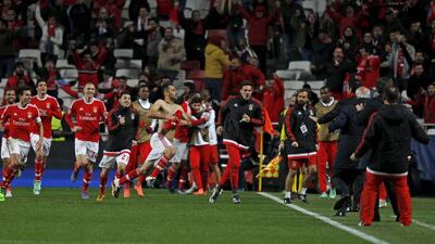 Benfica’s Jonas celebrates with team mates after scoring a goal against Zenit St. Petersburg. REUTERS/Hugo Correia