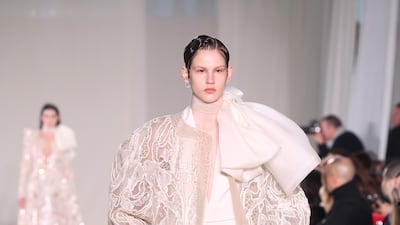 A lace cape over a trouser suit at Elie Saab. Getty Images
