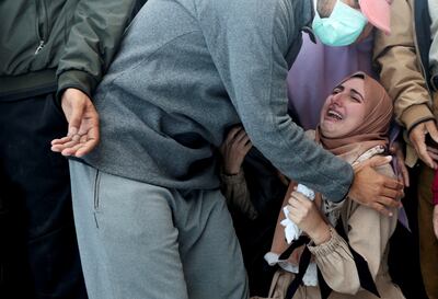 A woman reacts at the funeral of Palestinians killed in an Israeli strike at Al Aqsa Martyrs Hospital in Deir Al Balah, in the central Gaza strip, on Thursday. Reuters