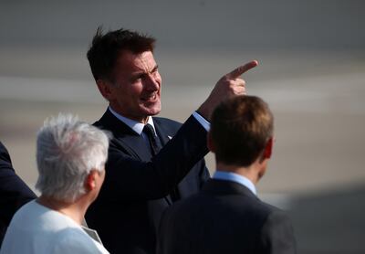 Britain's Foreign Secretary Jeremy Hunt greeted President Donald Trump and First Lady Melania Trump at Stansted Airport near London. Reuters