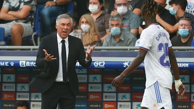 Real Madrid's head coach Carlo Ancelotti gives instructions to Eduardo Camavinga. AP Photo