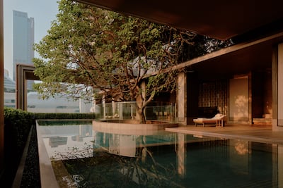 The pool is built around a century-old Sompong tree. Photo: Aman