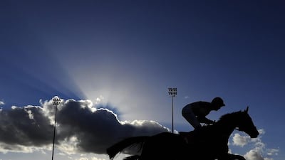 A runner passes the stands in The Betdaq £500 In Free Bets Handicap Steeple Chase at Kempton Park in Sunbury, England. Alan Crowhurst / Getty Images