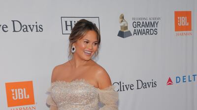 Model Chrissy Teigen, who is expecting her second child, wore a cream and gold Jonathan Simkhai gown. Andrew Kelly / Reuters