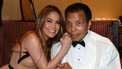 In this file photo taken on March 22, 2013 shows Singer Jennifer Lopez and boxer Muhammad Ali attending Muhammad Ali’s Celebrity Fight Night XIX at JW Marriott Desert Ridge Resort & Spa in Phoenix, Arizona. Michael Buckner / Getty Images North America / AFP