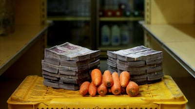 A kilogram of carrots is pictured next to 3,000,000 bolivars