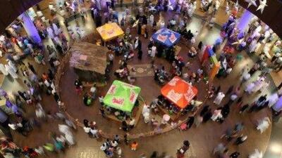 Families spend the early hours yesterday at a shopping mall in Dubai as they celebrate the last day of the Eid al-Fitr holiday. AFP