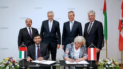 Suhail Al Mazrouei, UAE Minister of Energy and managing director of Ipic, and ÖBIB secretary-general Martha Oberndorfer sign the agreement in Vienna. Courtesy Ipic