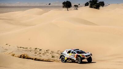 Sheikh Khalid Al Qassimi of Abu Dhabi Racing, in his Peugeot 2008 DKR, along with navigator Khalid Al Kendi, bash over dunes on the opening day of the Dubai International Baja on March 10, 2017. Courtesy Total Communications