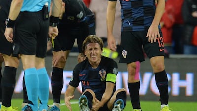 epa07919011 Croatia's Luka Modric (C) receives medical treatment during the UEFA EURO 2020 group E qualifier soccer match between Wales and Croatia held at Cardiff City Stadium in Wales, Britain, 13 October 2019. EPA/PETER POWELL