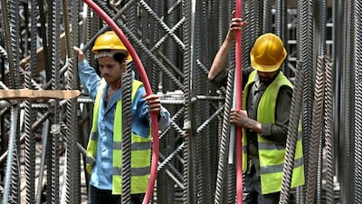 Workers from Saudi Binladin Group do foundation work at the Jeddah construction site of Kingdom Tower, which aims to become the world’s tallest skyscraper when completed. Hasan Jamali / AP Photo