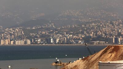 A truck pours earth into the Mediterranean sea to extend the closed Bourj Hammoud land fill on the outskirts of the Lebanese capital Beirut. The Bourj Hammoud solid waste dump occupies a surface area of 16.3 hectares and rises to about 55 m above sea level. Patrick Baz / AFP
