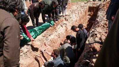 Syrians bury their dead after an April 4 chemical attack (Fadi Al Halabi/AFP Photo)