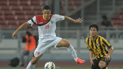 Patrick Fabiano's East Timor, left, drew 1-1 with Mohamad Fadhli's Malaysia in their 2018 World Cup qualifier in Kuala Lumpur on Thursday. Mohammed Rasfan / AFP