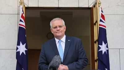Australia's Prime Minister Scott Morrison addresses reporters at Parliament House in Canberra on April 10. AFP