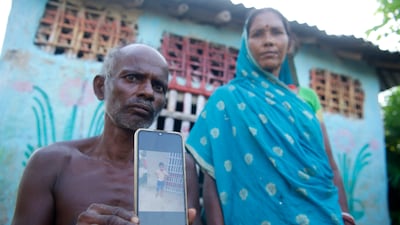 Panchanand Mahaldar, 60, and his wife Urmilla Devi, 50, with a photograph of their eight-year-old grandson Gaurav Kumar, who died of snakebite in July this year. Gaurav visited his grandparents at Singhia in Purnea in eastern state of Bihar for a summer holiday when he was bitten. Photos: Taniya Dutta / The National
