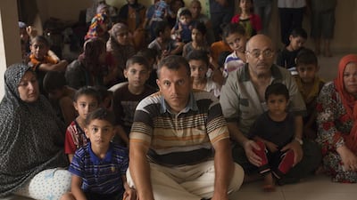 The family is now living with about 60 other relatives in a three-bedroom flat in downtown Gaza City that lacks electricity, furniture and hope. Heidi Levine for The National