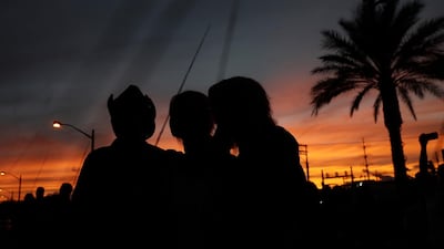 People gather to dedicate a healing garden. EPA
