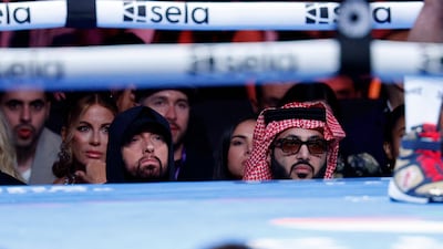 From left tonight: Kate Beckinsale, Eminem and Turki Alalshikh, the chairman of Saudi Arabia's General Entertainment Authority, seated ringside at the Terence Crawford and Israel Madrimov title fight. Getty Images