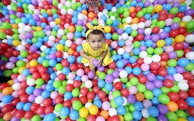 Children enjoy the first day of the Muslim holy festival at Kids Fun House in Qanat Al Qasba in Sharjah. Ali Haider / EPA