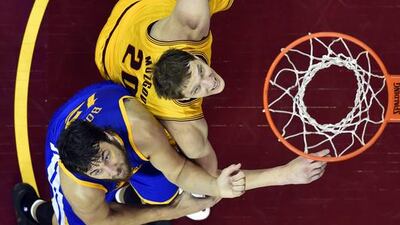 Cleveland Cavaliers center Timofey Mozgov (20) and Golden State Warriors center Andrew Bogut (12) go up for a rebound during the second half of Game 3 of basketball's NBA Finals in Cleveland, Tuesday, June 9, 2015. The Cavaliers defeated the Warriors 96-91. (Bob Donnan/Pool Photo via AP)