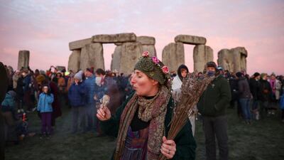 A reveller burns incense at the Stonehenge stone circle to welcome in the winter solstice last year. Reuters / Henry Nicholls