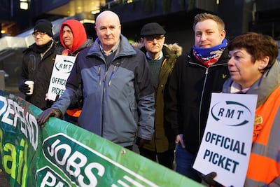 RMT boss Mick Lynch, third from left, on a picket line at London Euston station. PA