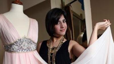 Aiisha Ramadan, shows off one of her dresses at her store, Corset Fashions, in Sharjah.