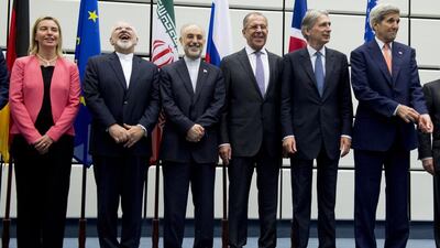 From left, the European Union high representative, Federica Mogherini; the Iranian foreign minister, Mohammad Javad Zarif; head of the Iranian Atomic Energy Organisation, Ali Akbar Salehi, the Russian foreign Minister Sergey Lavrov; the British foreign secretary Philip Hammond; and the US secretary of state John Kerry pose for a group picture at the United Nations building in Vienna after striking a landmark nuclear deal. Joe Klamar / Pool Photo via AP