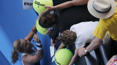 Dominika Cibulkova of Slovakia signs autographs after her giant-killing run at Melbourne came to an end. David Gray / Reuters