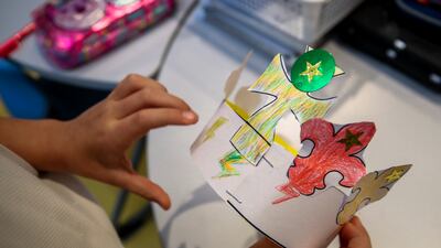 Colourful paper crowns were made in anticipation of the real thing. Victor Besa / The National