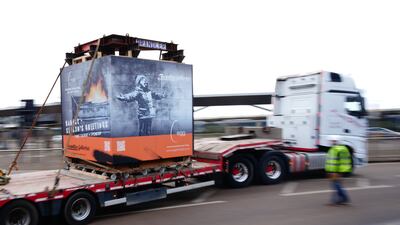 On Tuesday, 'Season's Greetings' by street artist Banksy was moved from a retail unit at Ty'r Orsaf, Port Talbot, to a temporary storage unit following attempts by 'fanatics' to damage the artwork. PA