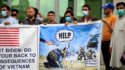 Former Afghan interpreters hold banners during a protest against the US government and Nato in Kabul. AP