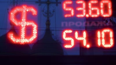 Russian Orthodox church crosses as reflected in a window of an exchange booth in Moscow, Russia. Russian president Vladimir Putin in his annual speech on Thursday announced measures to spur the flagging economy, saying that Russia's resurgent "geopolitical role" should be matched by a thriving economy. Ivan Sekretarev / AP Photo
