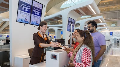 Etihad Airways welcomes the first passengers to check in at Terminal A. The airport is being renamed Zayed International Airport. All photos Etihad Airways