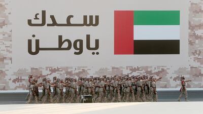 Military troops parade during 43rd National Day celebrations at Abu Dhabi National Exhibition Center. Christopher Pike / The National
