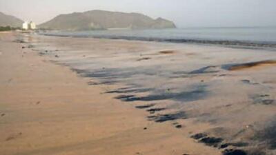 An oil spill off the coast of Fujairah washes up on shore in February. Hundreds of oil tankers are anchored off the coast of the UAE.